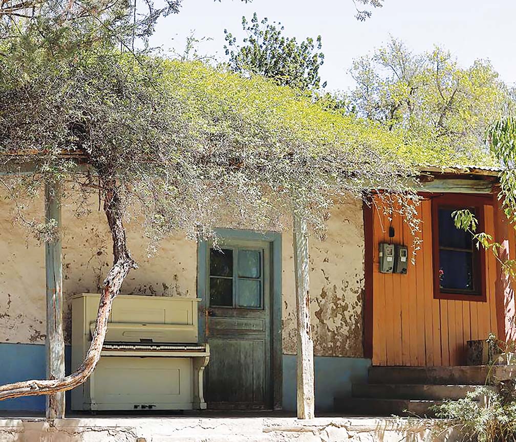 FICTION-PHOTO14_rustic-rural-house-old-piano-front-scene-white-187027914